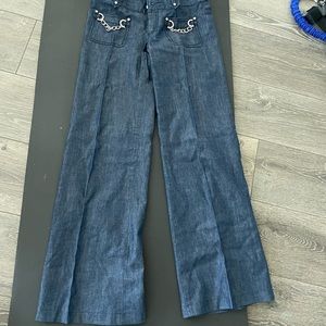 Michael Kors lightweight wide leg jeans. Pockets embellished with chains.